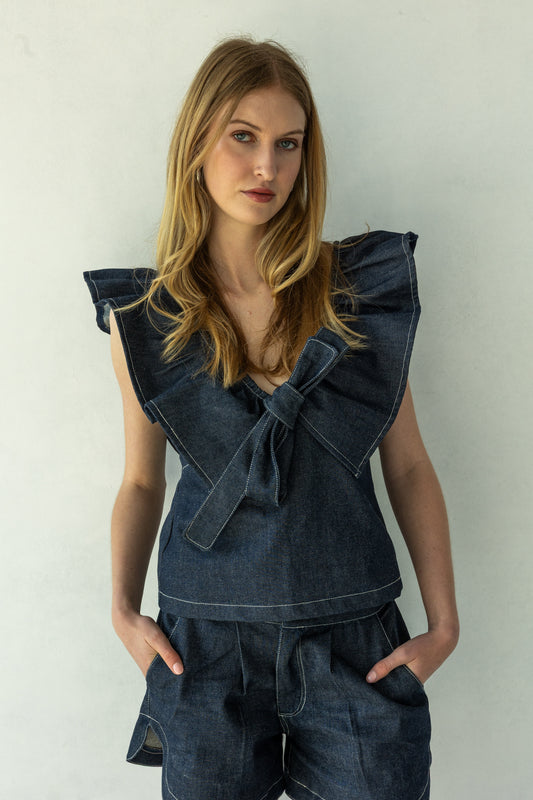 Rokkie Denim 09 / 01 Top — ruffle trim at the shoulder and open back, tied V-neck