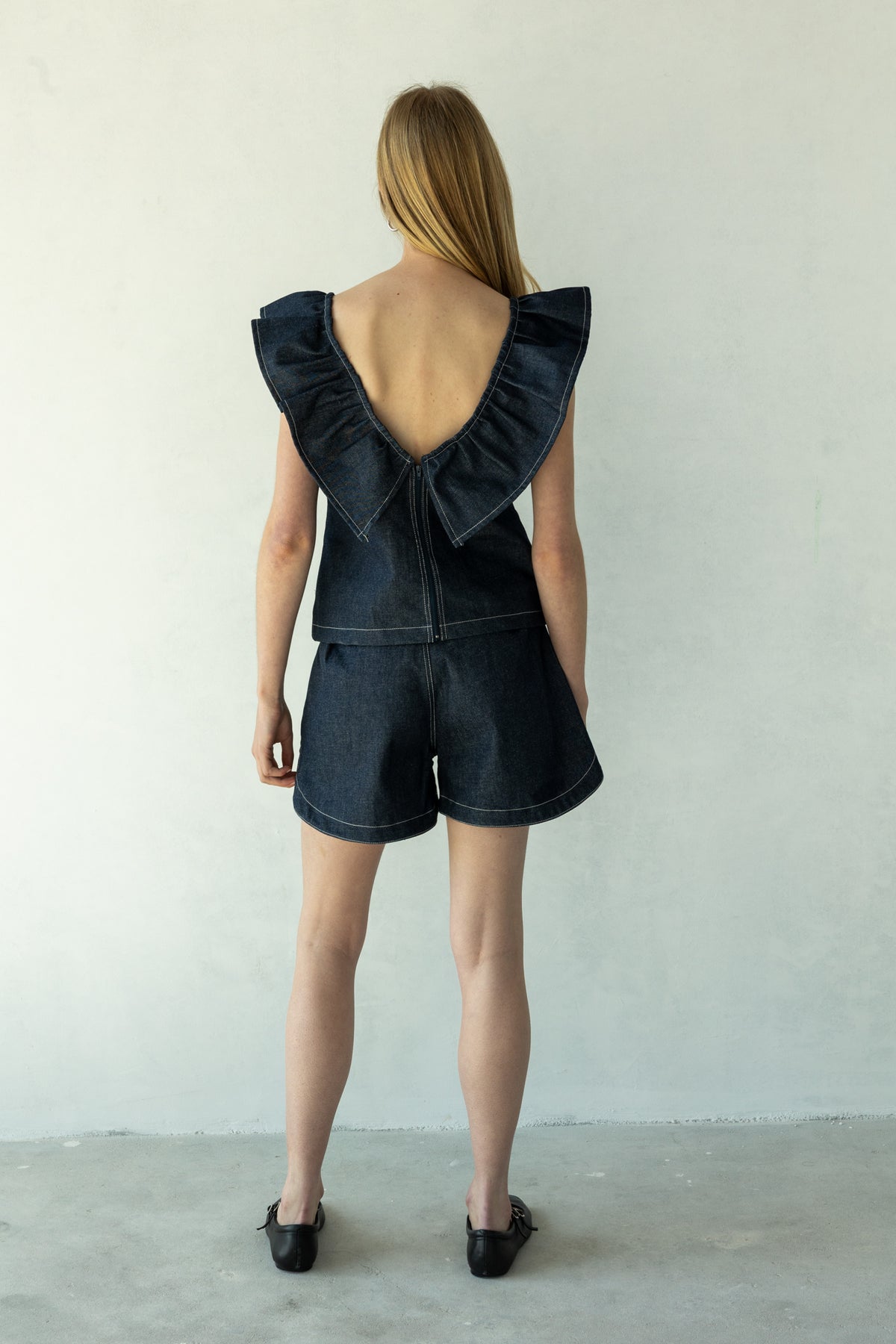 Rokkie Denim 09 / 04 Short — high-waisted short, curved hem at the side seam